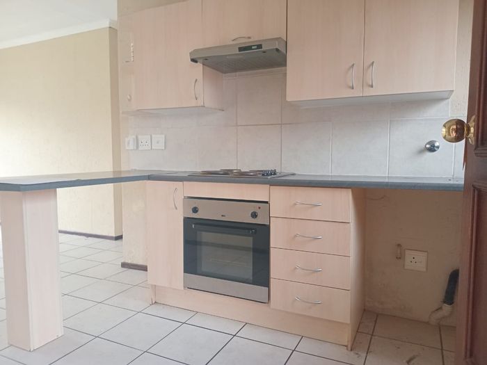 Rynfield AH Apartment To Rent: 2 Bedrooms, secure complex, open-plan living, prepaid electricity.