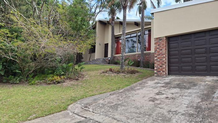 For Sale: House in Beacon Bay North with pool, double garage, and guest cabins.