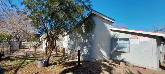 Brandwag House For Sale: Student accommodation with 15 bedrooms, braai area, and solar panels.