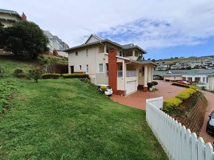 To Rent: Townhouse in Kindlewood Estate with garden, balconies, and clubhouse amenities.