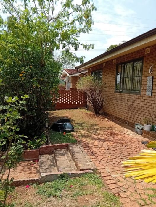 3-Bedroom Apartment For Sale in Bedford Gardens with secure parking and private braai area.