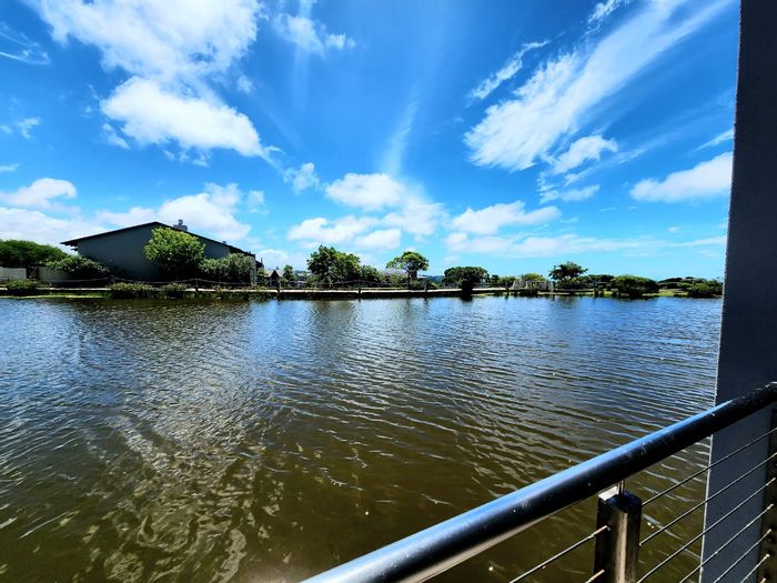 Oubaai Apartment For Sale: 2-bed, golf estate access, waterfront views, secure living.