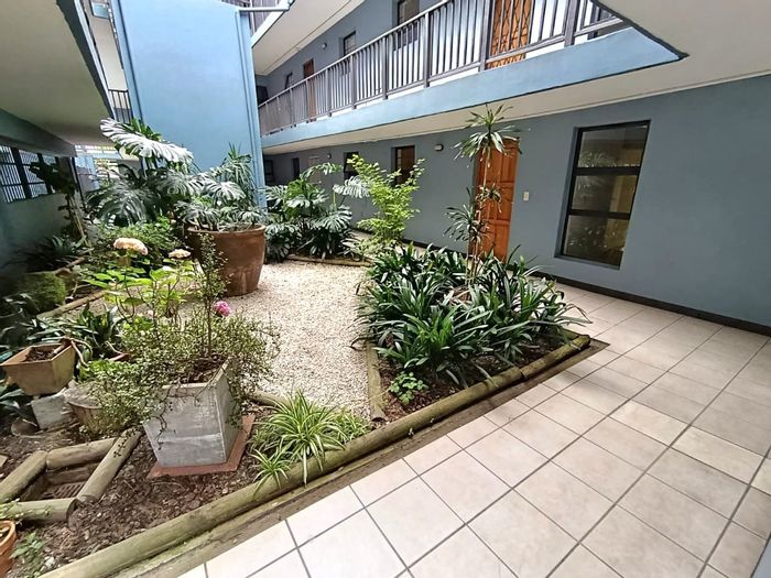 For Sale: 2-Bedroom Apartment in Knysna Central with Secure Parking and Private Patio.