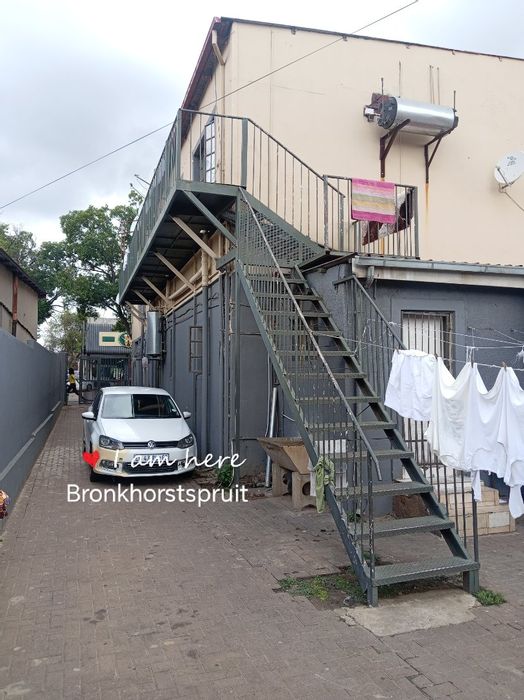 Commercial property for sale in Bronkhorstspruit Central with 17 bachelors and retail shops.