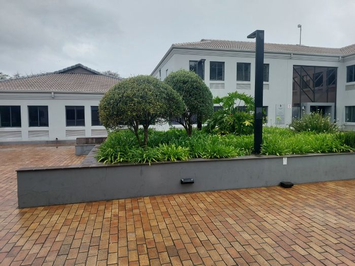 Bryanston Commercial Office To Rent: Ground-floor suite with parking, security, and café.