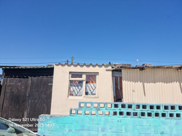 2-Bedroom House For Sale in Eindhoven with spacious lounge, carport, and large backyard.