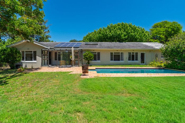 For Sale: Spacious Constantia house with pool, garden, and energy-efficient features.