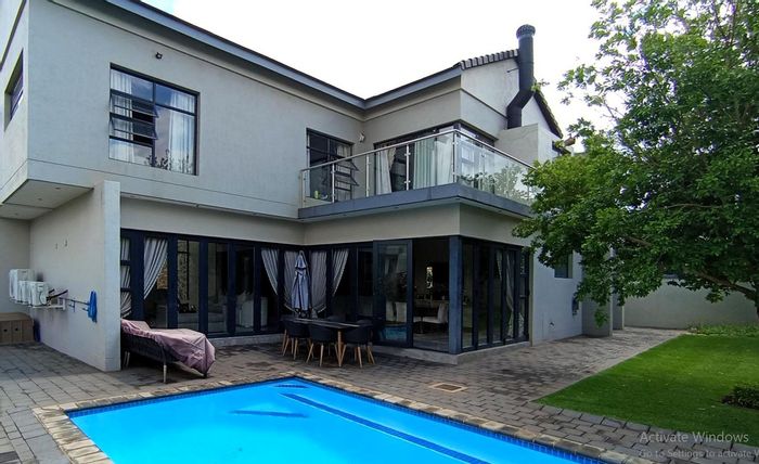 For Sale: House in Midstream Estate with pool, 4 beds, and inverter system.