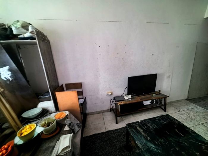 1-Bedroom Apartment For Sale in Point with enclosed balcony and spacious lounge.