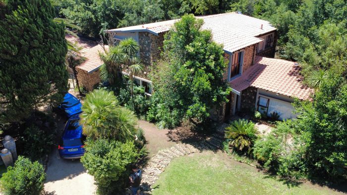 For Sale: Spacious 4-Bedroom House in Songloed with Double Garage and Garden.