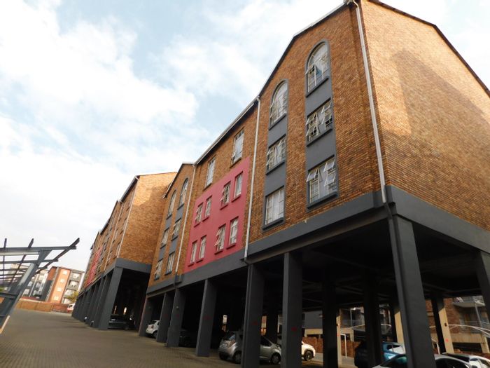 For Sale: Grand Central Apartment with security, parking, and convenient transport access.