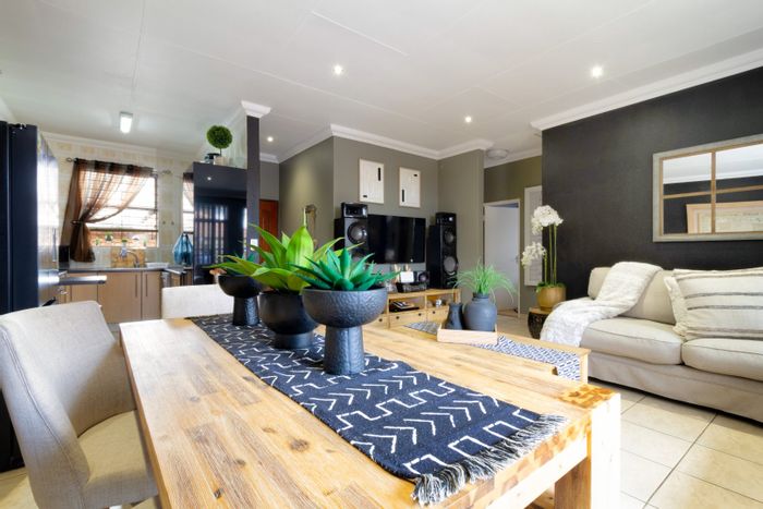 For Sale: Townhouse in New Market Park with secure complex, garden, and solar panels.