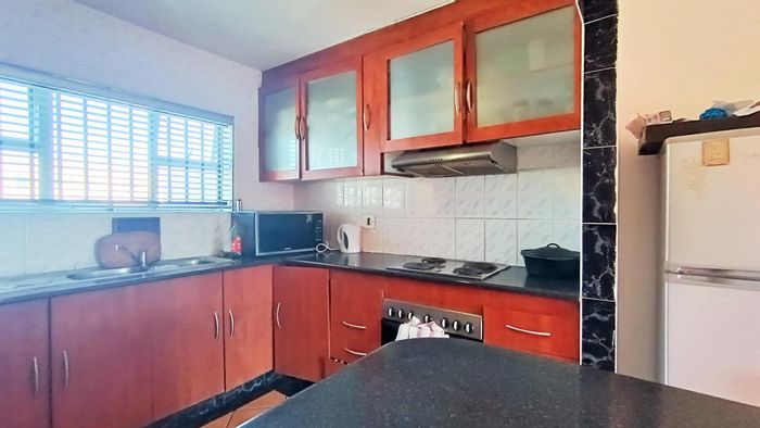 Townhouse for sale in Mitchells Plain Central: 3 beds, carport, fully enclosed.