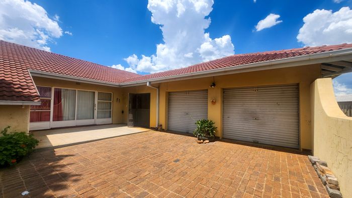 Versatile 3-bedroom house with flat, double garage in Hartbeesfontein, For Sale.