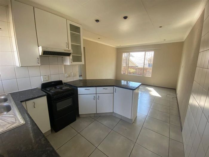 Lakefield Townhouse For Sale: 2 beds, pool, secure carport, functional layout.