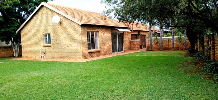 3-Bedroom House To Rent in Heuwelsig Estate with garden, double garage, and secure living.