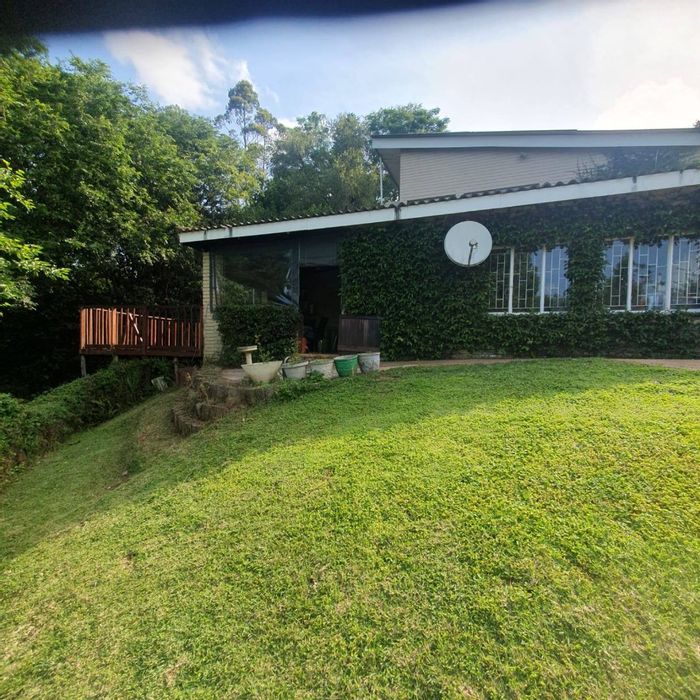 Charming Boughton townhouse for sale with garden, deck, and granny cottage potential.