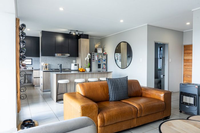 For Sale: House in Rooihuiskraal North with security, clubhouse, and trails.