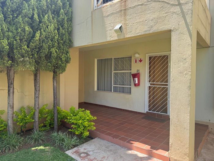2-Bedroom Apartment For Sale in Wilkoppies with Private Garden and Secure Parking.