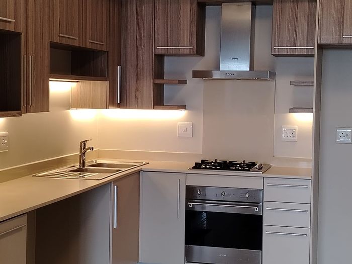 Rosebank apartment to rent: 2 beds, 2 baths, balcony, secure parking, pet-friendly.