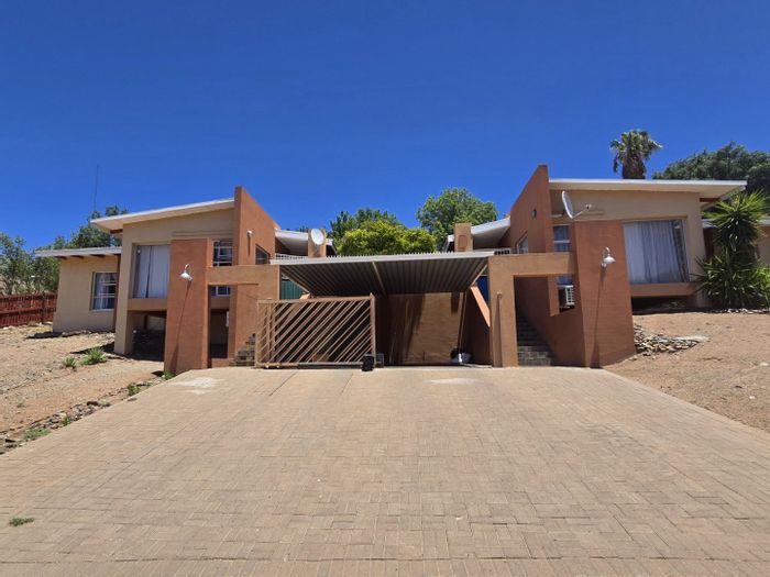 Keidebees House For Sale: Two homes, rental income potential, private outdoor spaces.