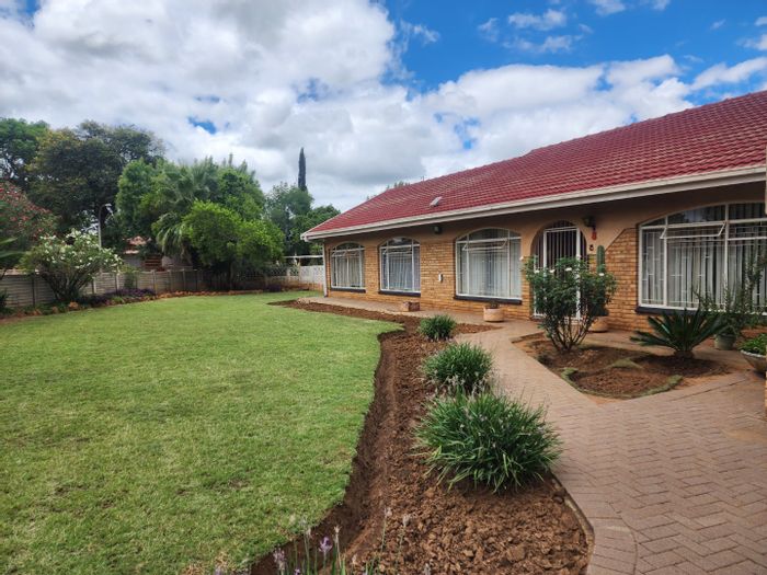 4-Bedroom House with Flatlet for Sale in Roosheuwel, featuring security and spacious living.