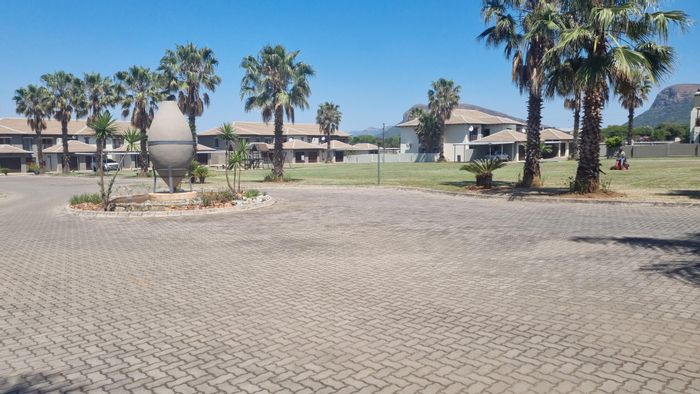 For Sale: Townhouse in Melodie with garden, garage, pool, and clubhouse access.