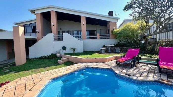 Uvongo House For Sale: 3 beds, pool, sea views, solar power, and security.