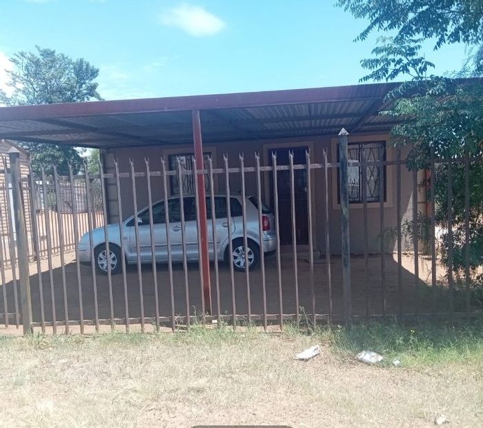 For Sale: Grasslands House with 2 Bedrooms, Carport, and Fenced Yard.