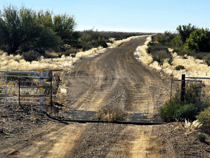 Calvinia Rural Farm for Sale: 5201 hectares, water access, livestock facilities, renovation potential.