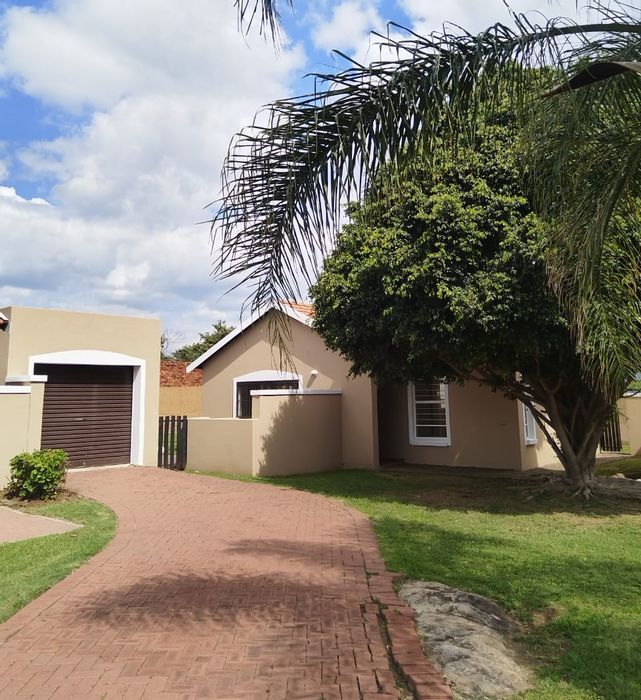 House for Sale in Brits Central: 2 beds, secure estate, outdoor braai, garage.