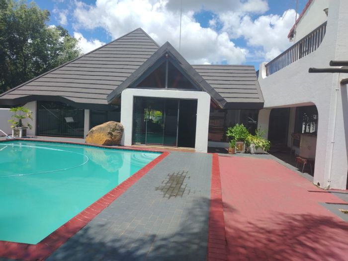 For Sale: Spacious Reyno Ridge house with 7 bedrooms, pool, and multiple outbuildings.