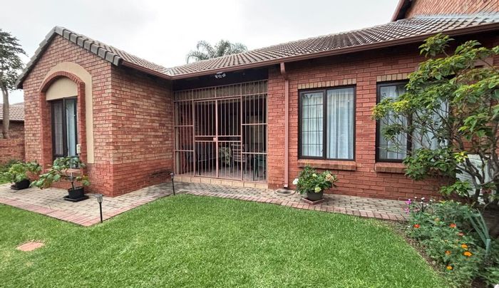 For Sale: Eco Park Estate Townhouse with 4 bedrooms, garden, and double garage.