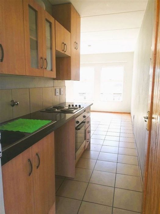 For Sale: Apartment in Kempton Park Central with 2 bedrooms, garage, and low maintenance.