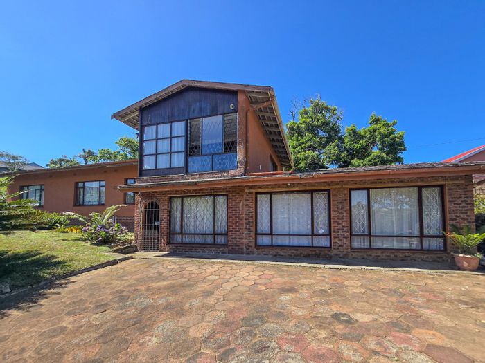 Versatile 5-bedroom house with sea views, triple garage, and flexible living options in Shelly Beach. For Sale.