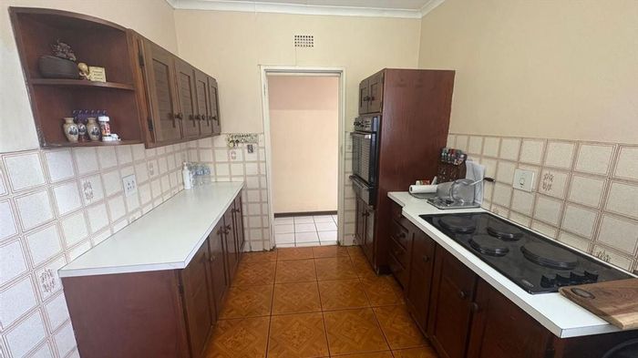 For Sale: House in Rynsoord with 4 bedrooms, en-suite, and spacious living areas.