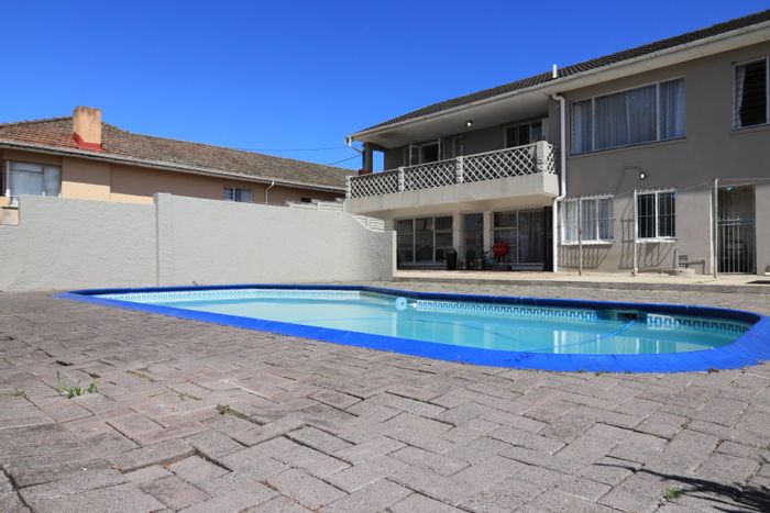 Spacious Greenfields house with pool, large garden, and versatile living spaces for sale.