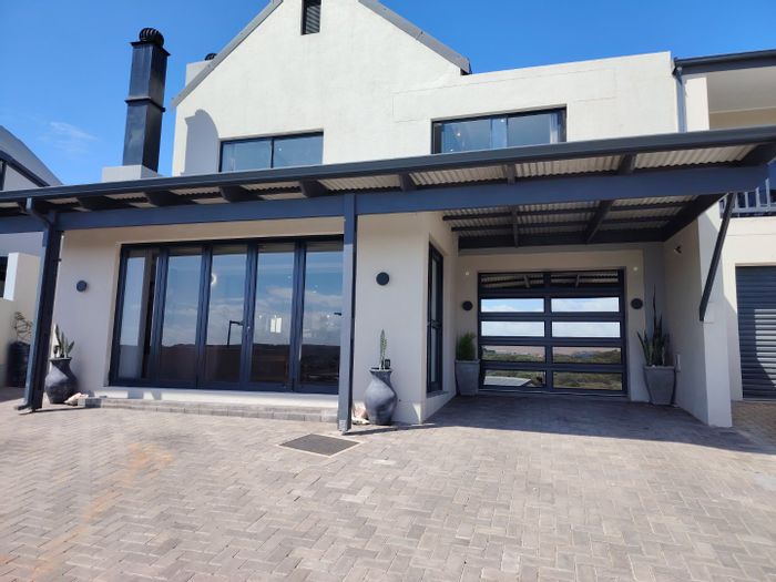 For Sale: Hartenbos Central House with river access, secure estate, and outdoor braai.