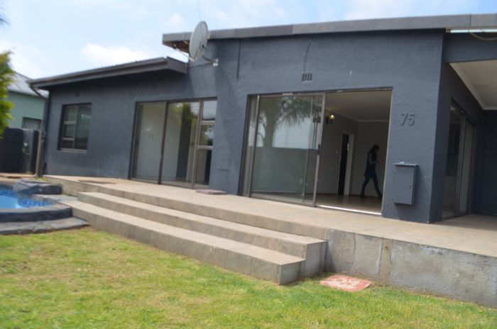 Spacious 6-bedroom house with pool, flatlet, and ample parking in Krugersdorp West. For Sale.