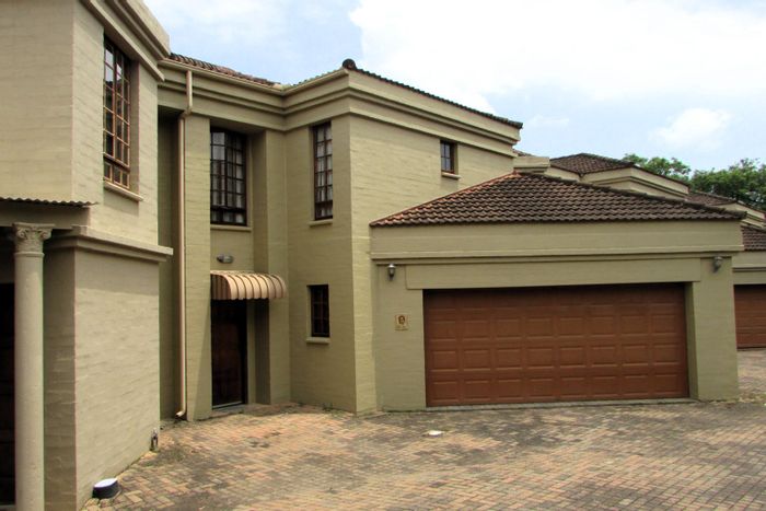 For Sale: Townhouse in White River Central with pool, office, and double garage.