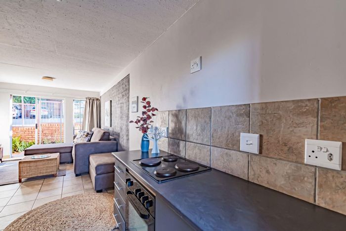 For Sale: 2-Bedroom Apartment in Rooihuiskraal North with secure estate living.