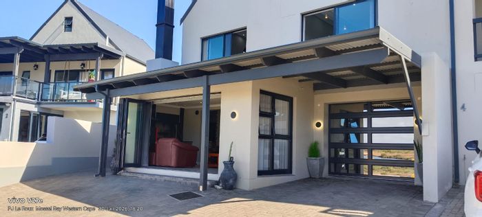 For Sale: House in Hartenbos Rural with river access, secure estate, and playground.