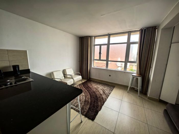 Beachside Apartment For Sale in Point: Open-plan living, bar-style kitchen, B&B-friendly.