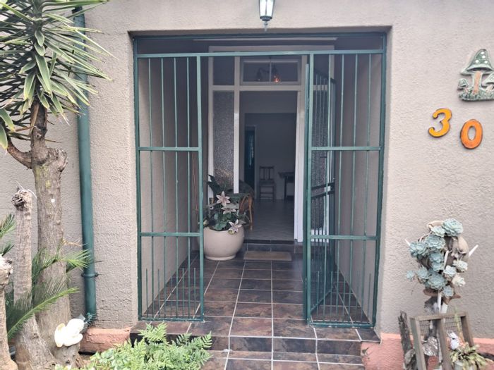For Sale: House in Krugersdorp West with spacious layout, garden, and rental potential.