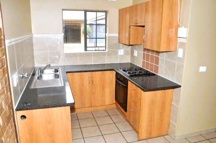 1-Bedroom Apartment To Rent in Wonderboom South with secure parking and easy access.