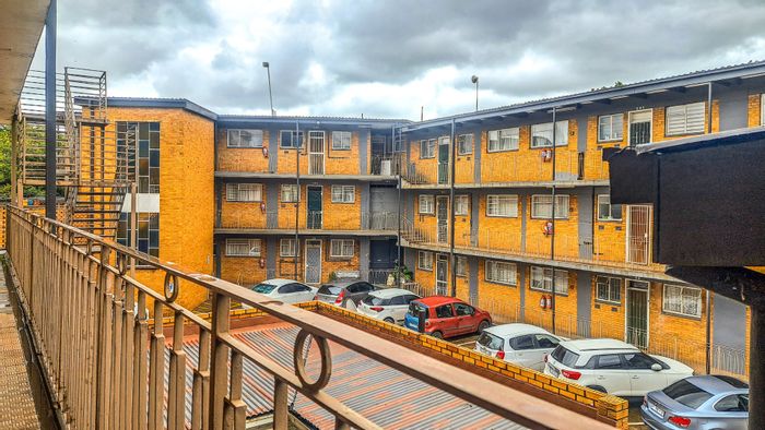 2-Bedroom Apartment For Sale in Vanderbijlpark CE 1 with balcony and convenient amenities.