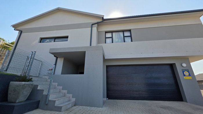 Island View House For Sale: 3 beds, double garage, sea views, versatile living spaces.