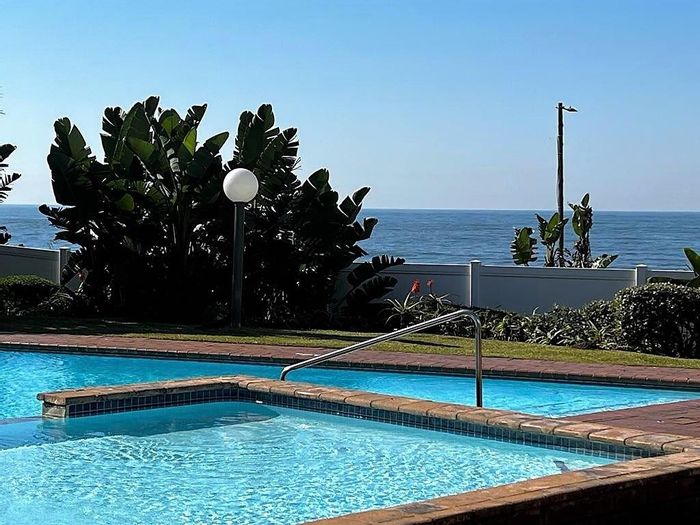 Uvongo Apartment for Sale: Sea-View Balcony, 2 Pools, Direct Beach Access!