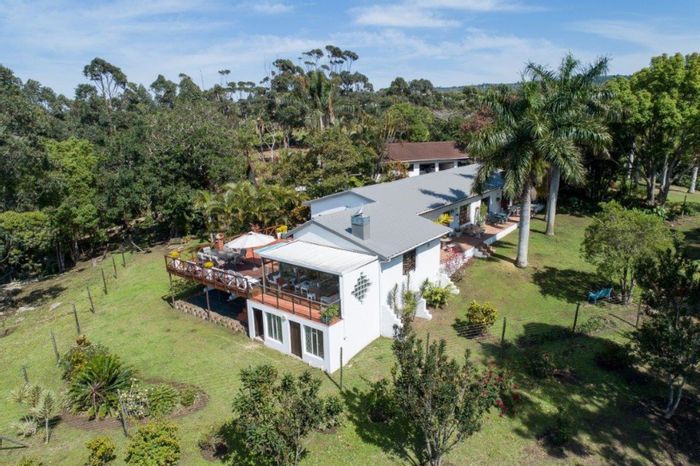 For Sale: Banners Rest Farm with Income-Generating Cottages and Macadamia Trees!