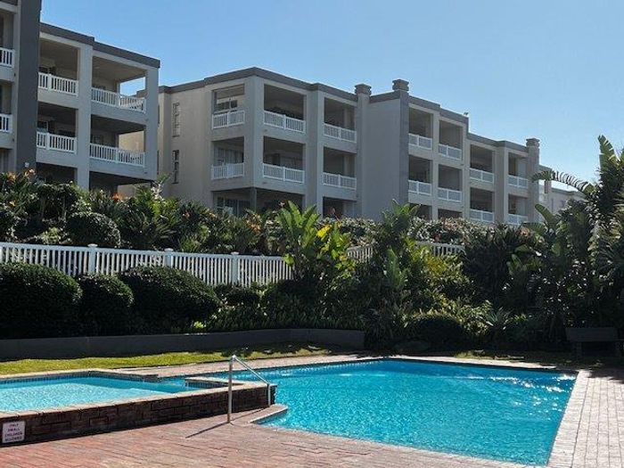 Uvongo Apartment For Sale: Beach access, pools, tennis courts, and rental income potential.